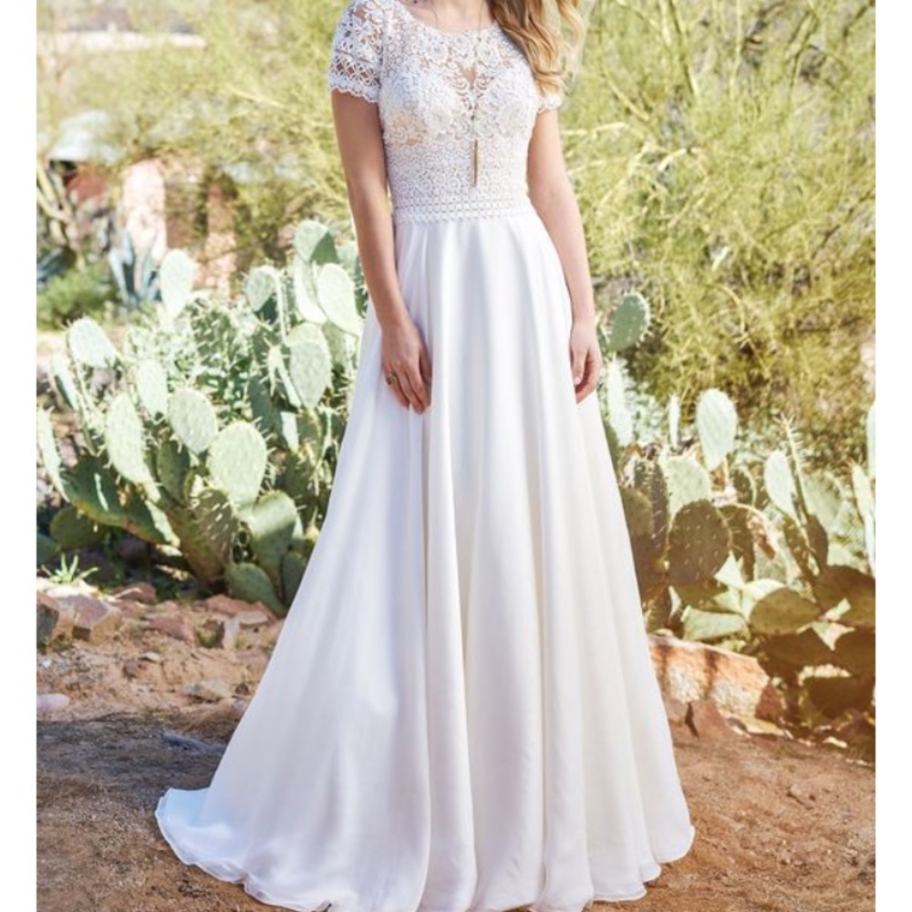Lillian west Bohemian style wedding gown.